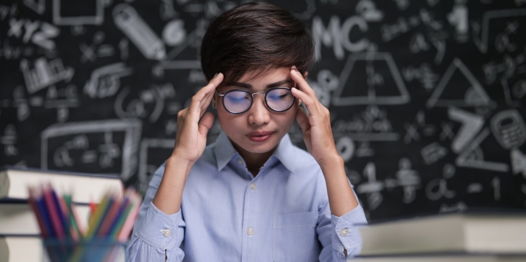The teacher sat thinking about teaching in the classroom