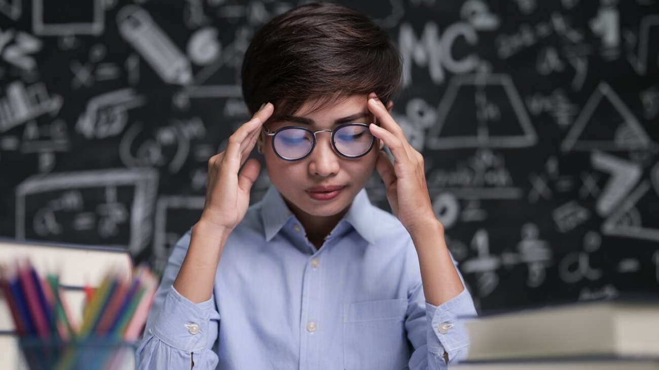 The teacher sat thinking about teaching in the classroom